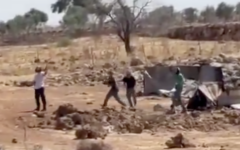 Settlers hurl stones, reportedly during clashes with Palestinians in the West Bank town of Sinjil on July 11, 2025. (Screen capture: Al-Jarmaq News)